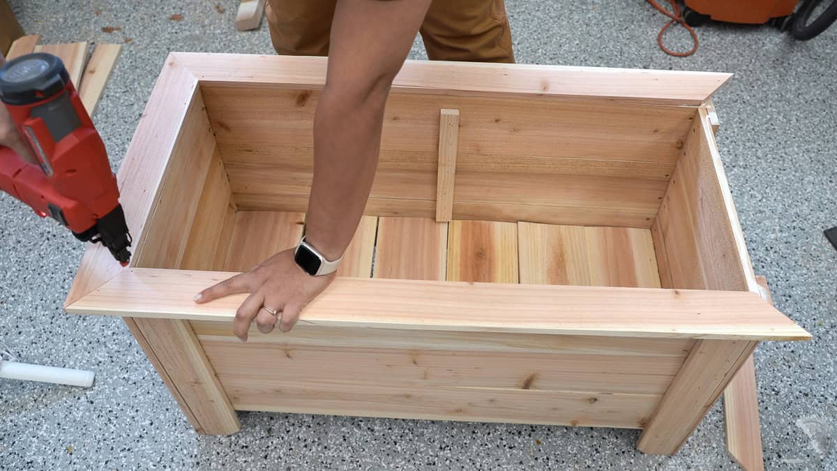 Attaching the top trim using a nail gun