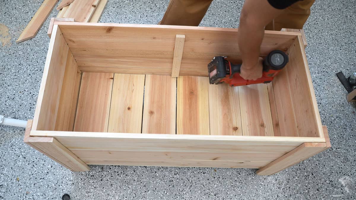 Attaching the bottom slats to the planter