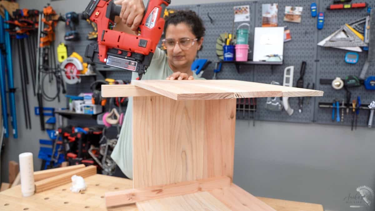 Assembling the three sides of the DIY planter box upside down to ensure the boards are flush before final nailing.