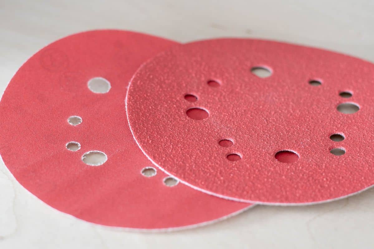 2 sanding discs of different grit