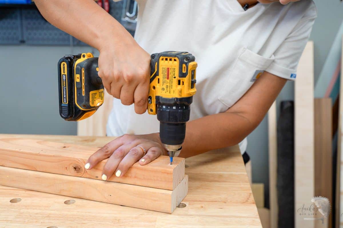 Pre drilling wood for a screw to keep the wood from splitting