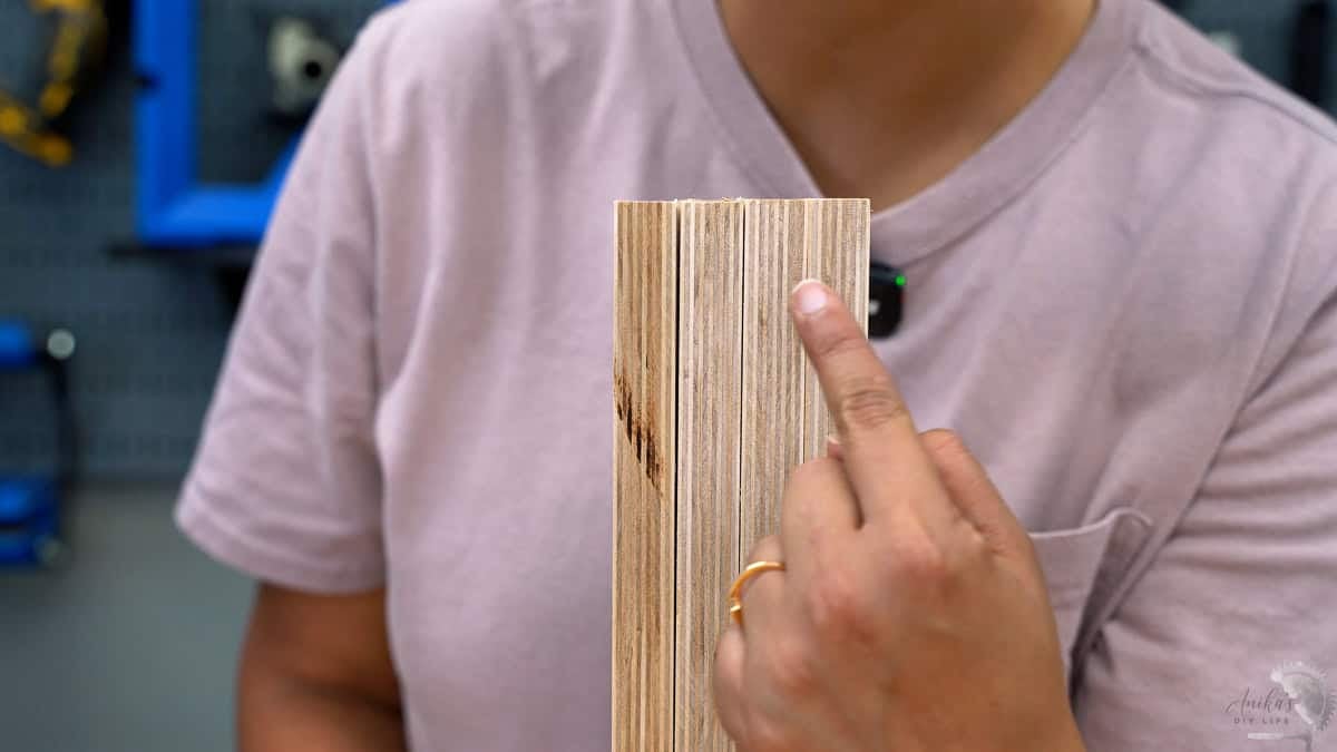 Anika showing a close up of the boards showing the slight discrepancy in the sizes.
