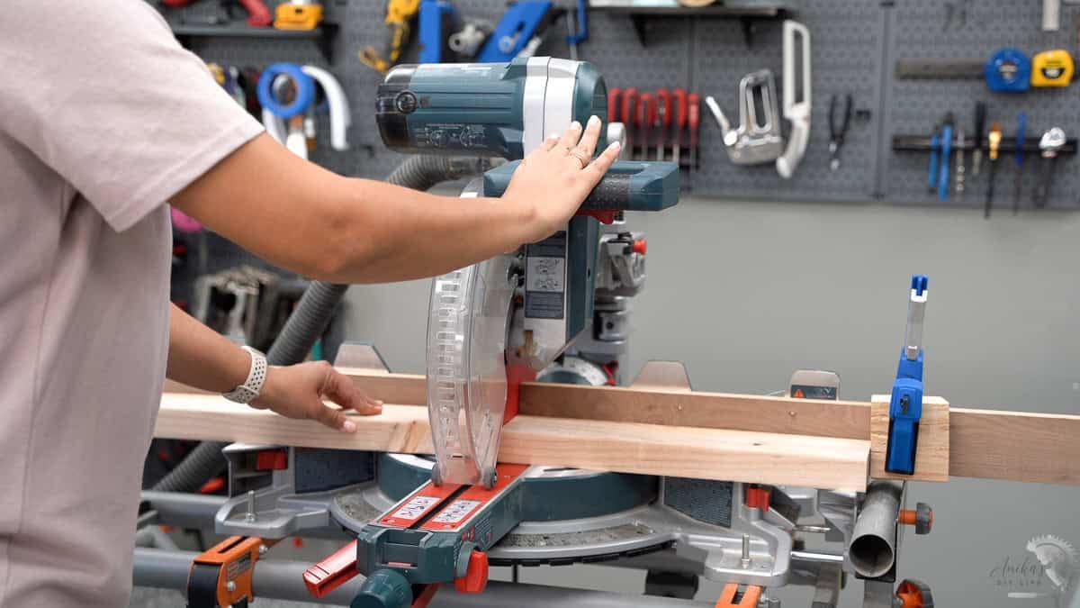 Making cuts on the miter saw using a stop block.