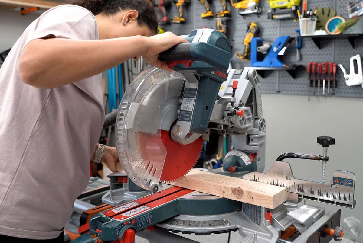 Anika setting up the board on the saw.
