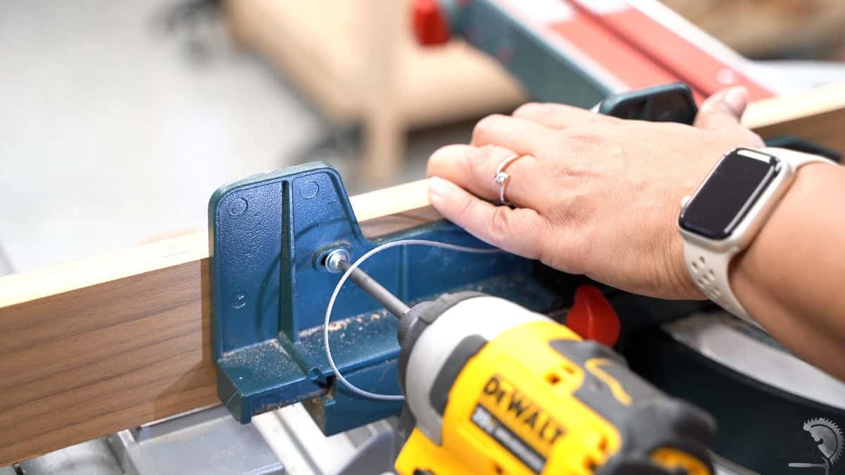 Attaching the temporary fence to the miter saw
