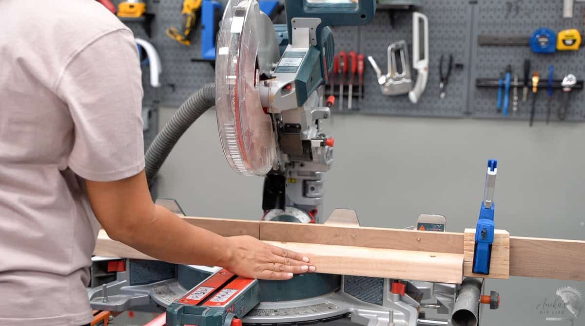 Showing how to use stop block on a bosch miter saw